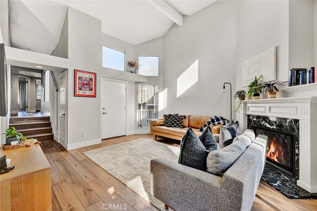 789 Grayling Bay Costa Mesa, CA 92626 - Photo 4 of 42 a living room with furniture and a fireplace