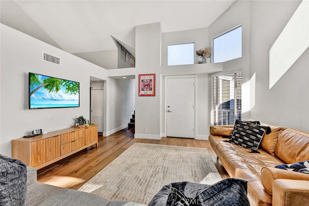 789 Grayling Bay Costa Mesa, CA 92626 - Photo 5 of 42 a bedroom with furniture and a wooden floor