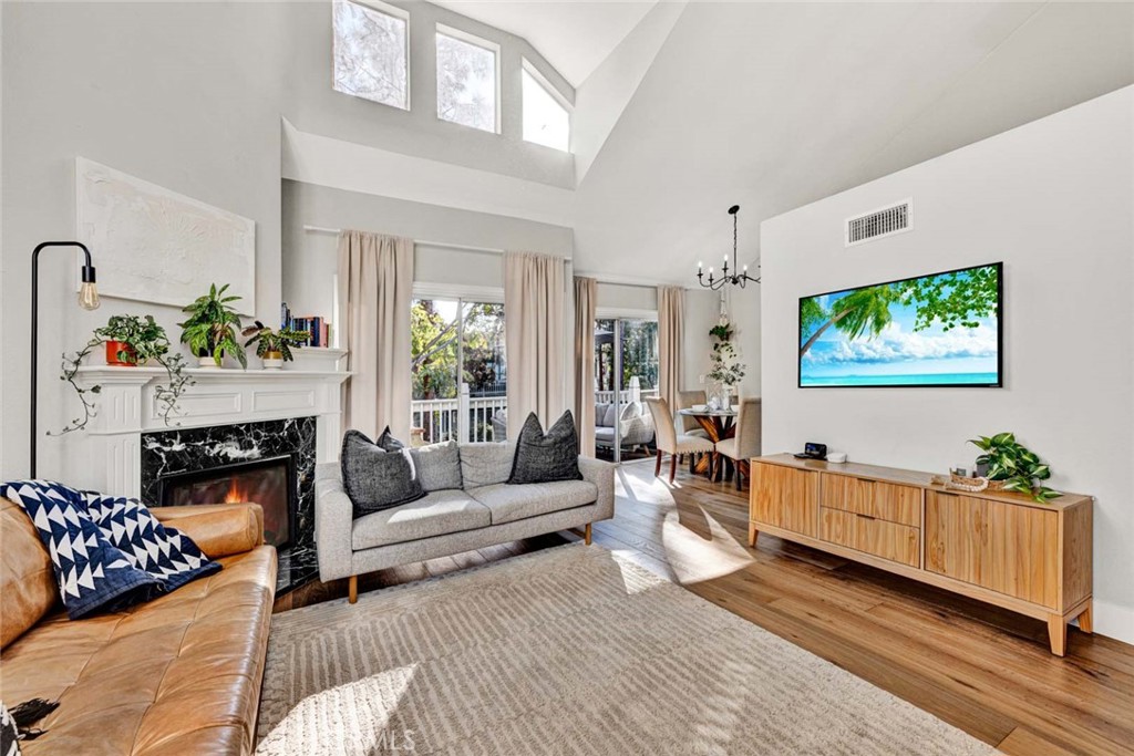 789 Grayling Bay Costa Mesa, CA 92626 - Photo 6 of 42 a living room with furniture fireplace and flat screen tv