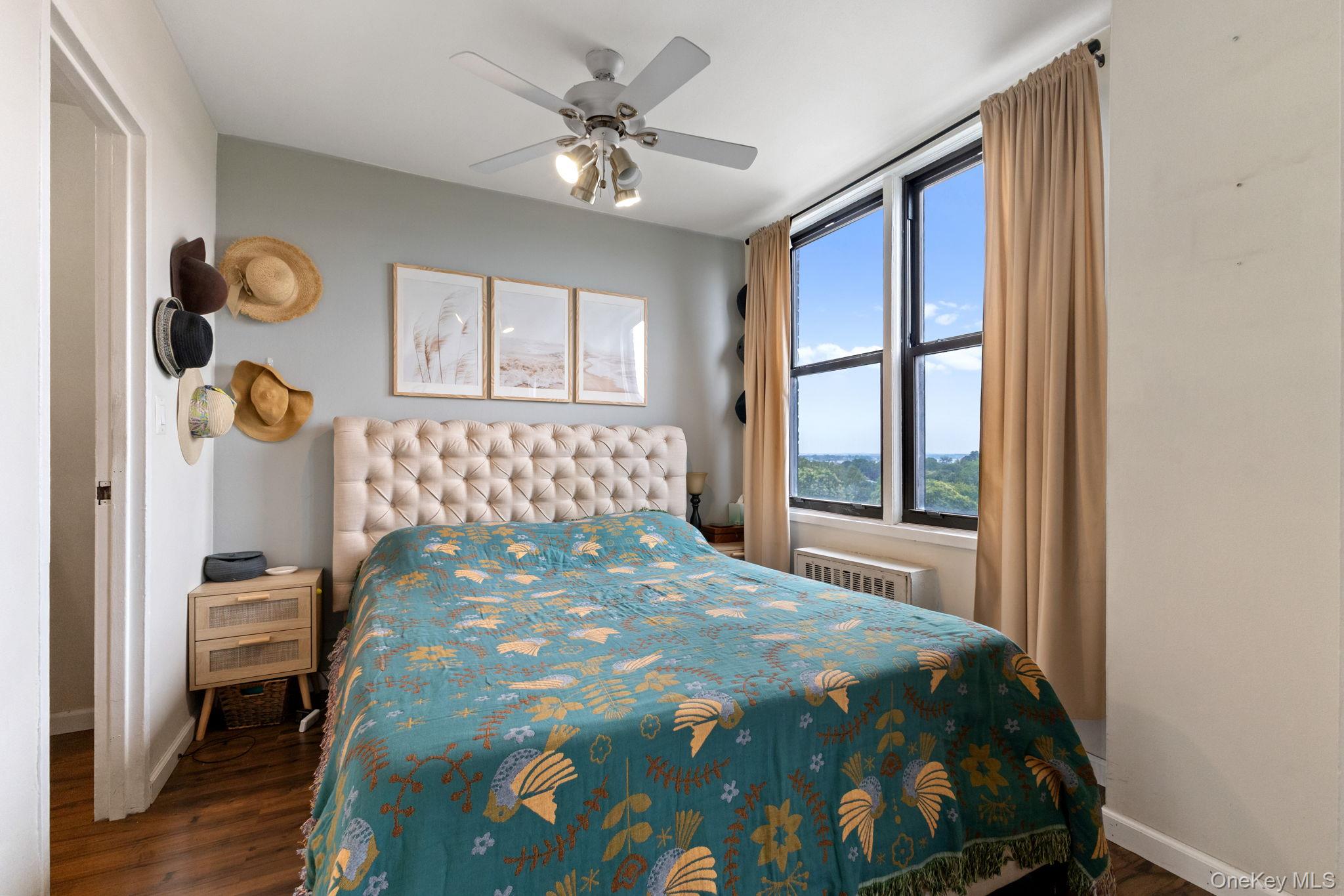 3121 Middletown Road, Unit 7L Bronx, NY 10461 - Photo 17 of 23 a bedroom with a bed and wooden floor