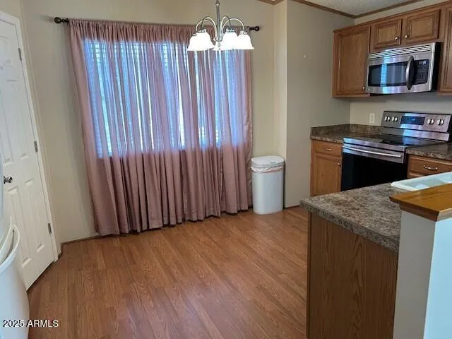 a kitchen with a sink and a stove top oven
