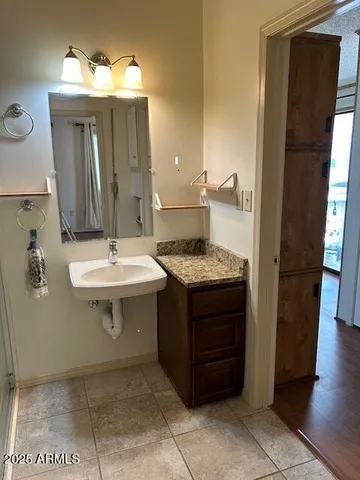 a bathroom with a sink and a mirror