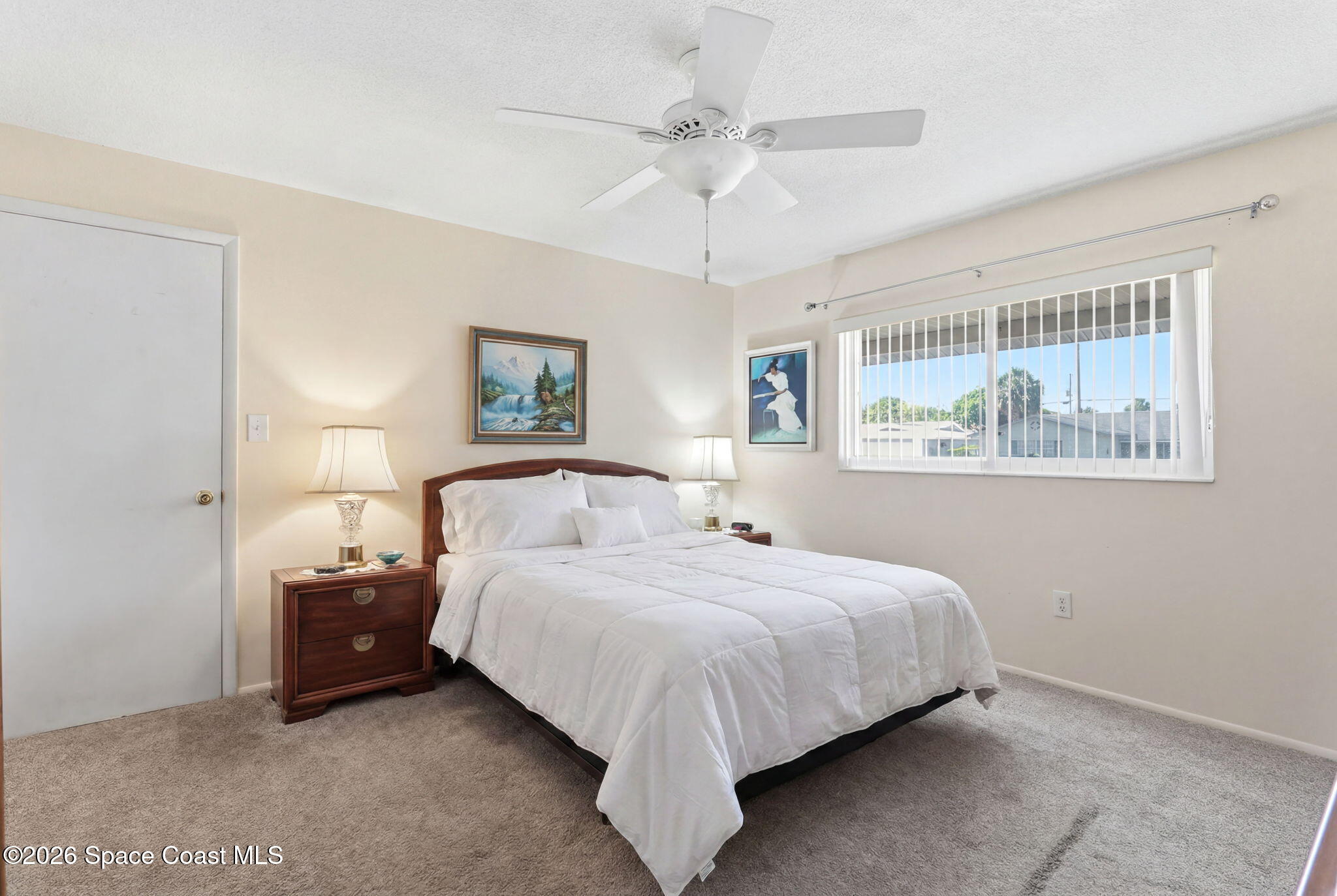 908 Jefferson Road Rockledge, FL 32955 - Photo 10 of 37 a bedroom with a bed and a painting on the wall