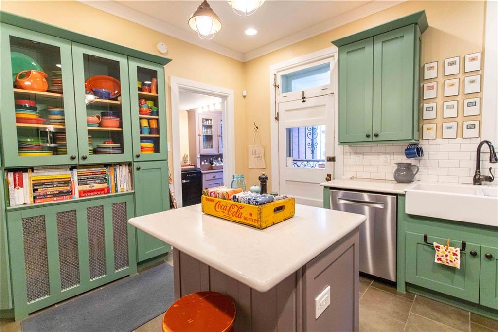 5901 Hampton Street Pittsburgh, PA 15206 - Photo 11 of 42 a kitchen with a sink a stove and a refrigerator