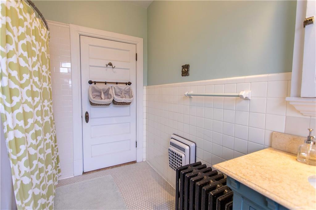 5901 Hampton Street Pittsburgh, PA 15206 - Photo 24 of 42 a bathroom with a sink a toilet and shower