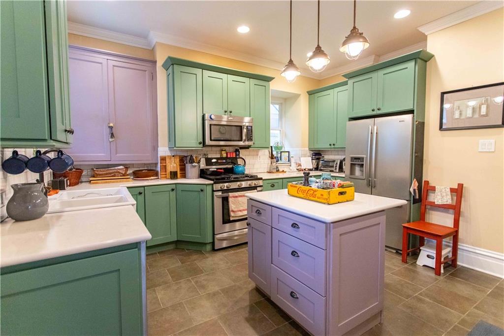 5901 Hampton Street Pittsburgh, PA 15206 - Photo 9 of 42 a kitchen with sink refrigerator and microwave