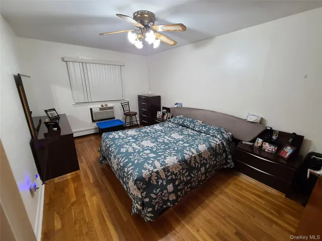 a bedroom with bed and a window