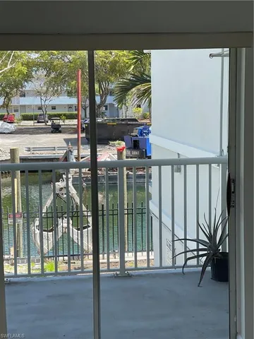 a white toilet sitting next to a shower