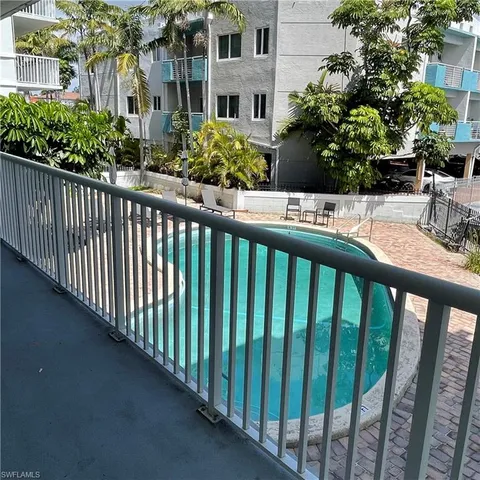 a view of a street with flower garden