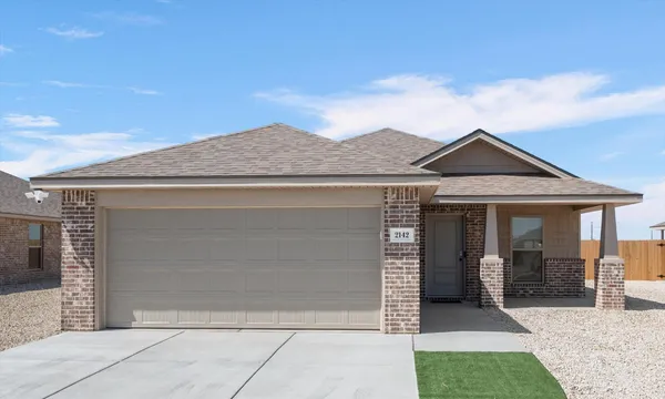 a view of house and garage