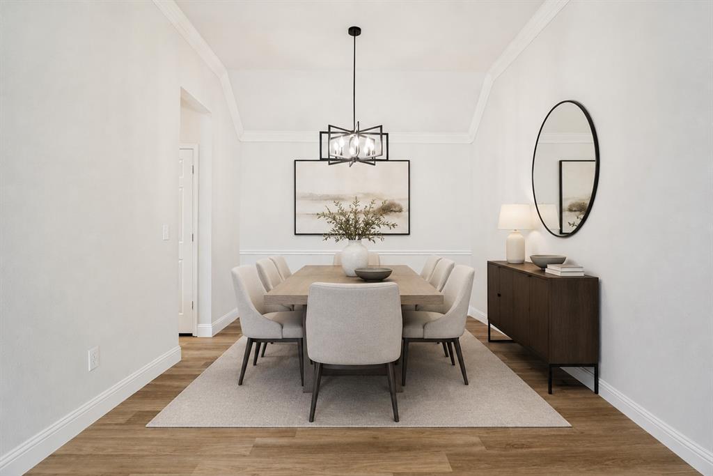 3020 Ridge Hollow Drive Plano, TX 75023 - Photo 7 of 28 Formal dining area featuring wood-finish flooring, white wainscoting, and crown molding