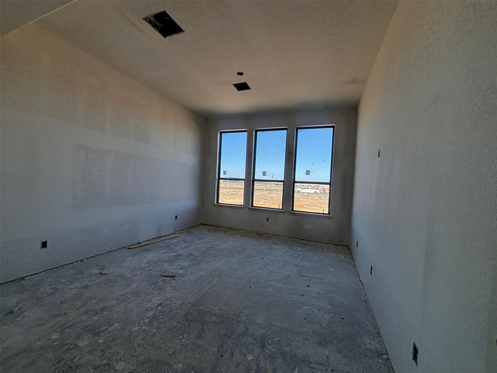 7826 Jasper Meadows Way Angleton, TX 77515 - Photo 25 of 34 an empty room with a empty space and windows