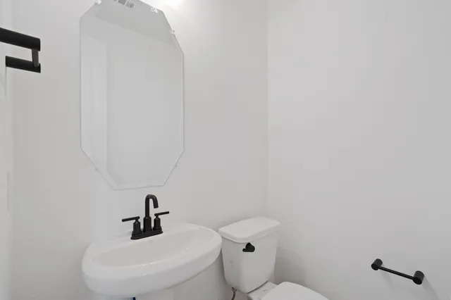 a bathroom with a sink and a toilet