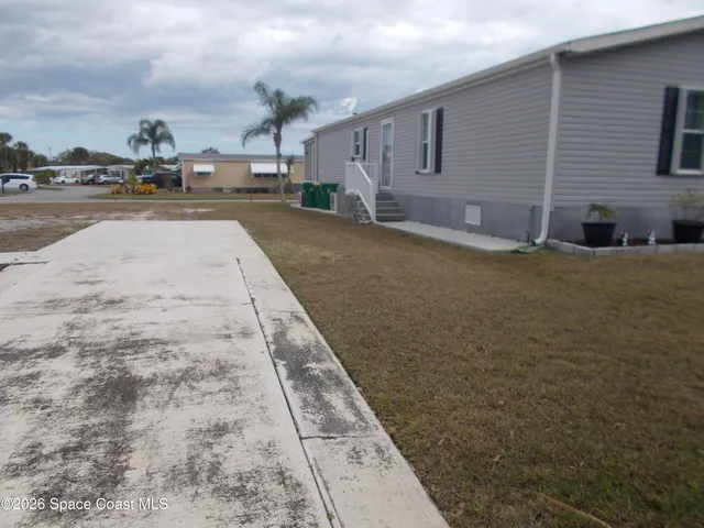 a view of a backyard of the house