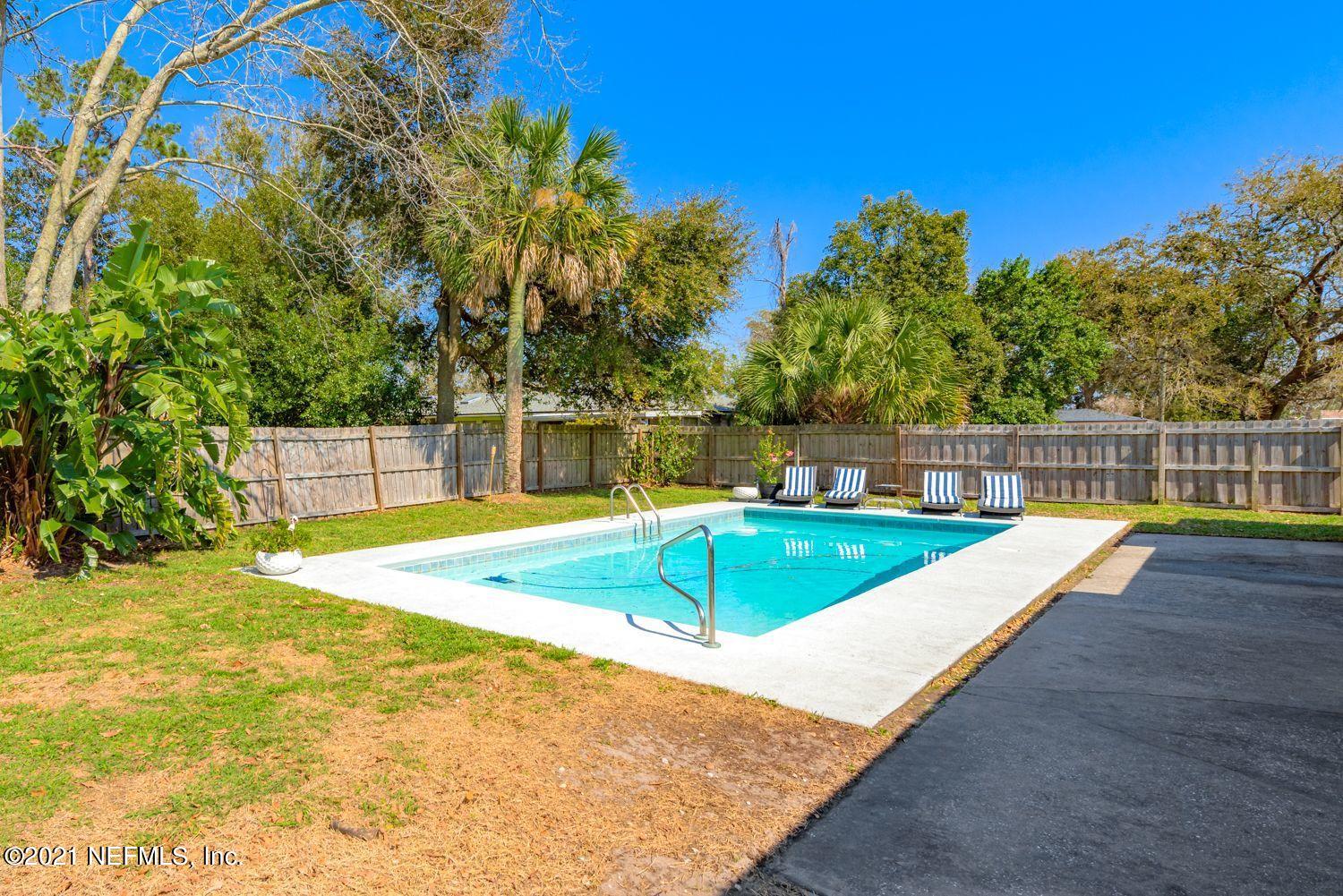 14443 Stacey Road Jacksonville, FL 32250 - Photo 13 of 16 a view of a swimming pool with a yard