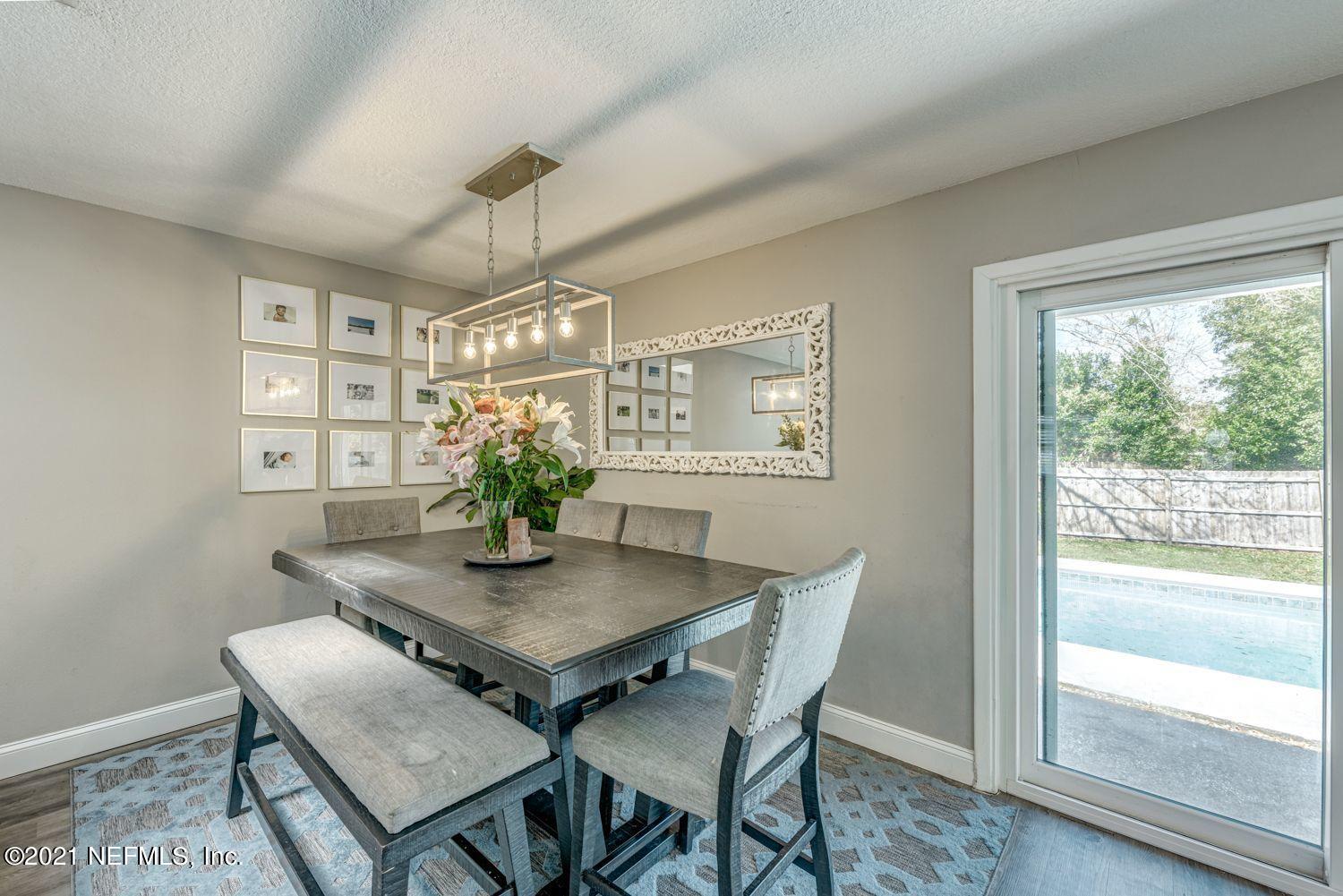 14443 Stacey Road Jacksonville, FL 32250 - Photo 4 of 16 a view of a dining room with furniture window and wooden floor