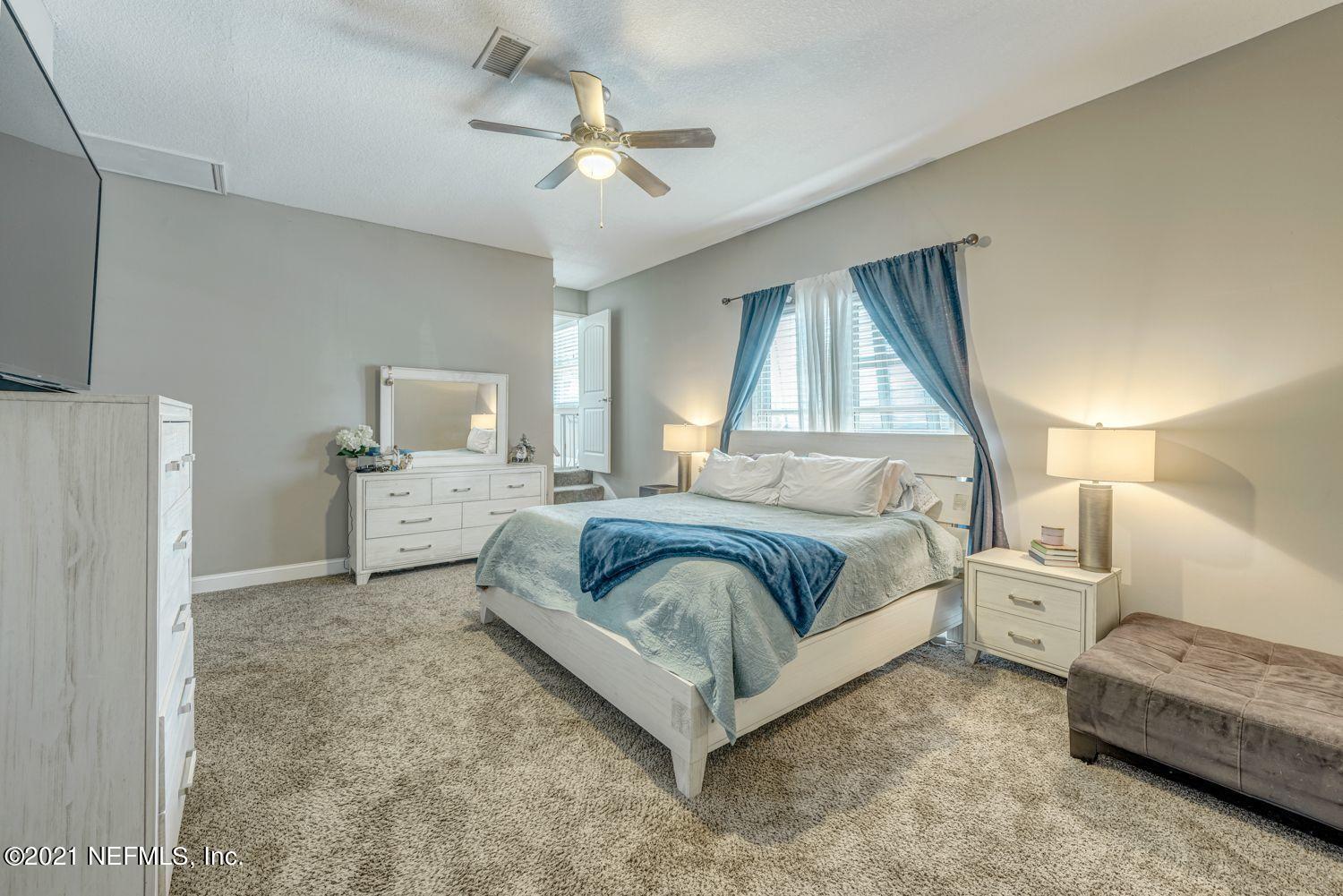 14443 Stacey Road Jacksonville, FL 32250 - Photo 9 of 16 a spacious bedroom with a bed and window