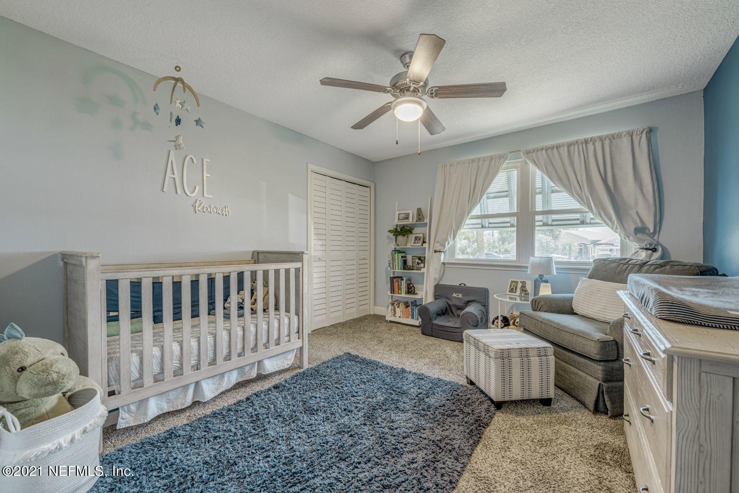 14443 Stacey Road Jacksonville, FL 32250 - Photo 10 of 16 a living room with furniture and a large window