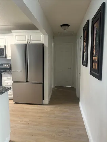 a bathroom with a toilet and shower