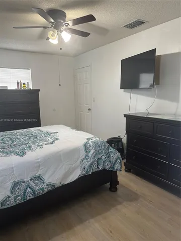 a bathroom with a toilet sink and shower