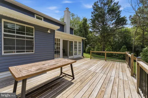 a view of a wooden deck with a bench