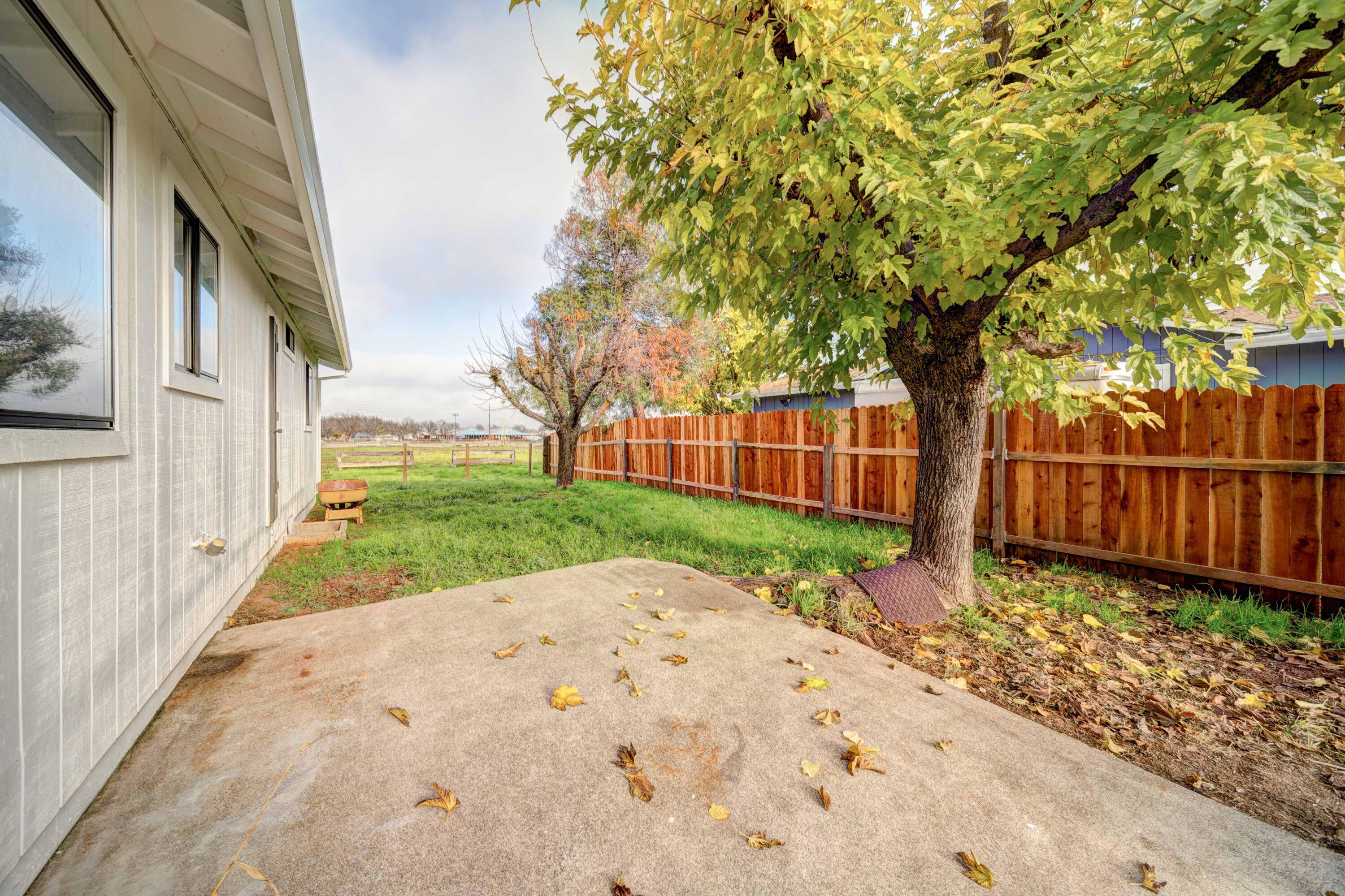 1611 2nd Street Anderson, CA 96007 - Photo 16 of 20 a view of a backyard with wooden fence