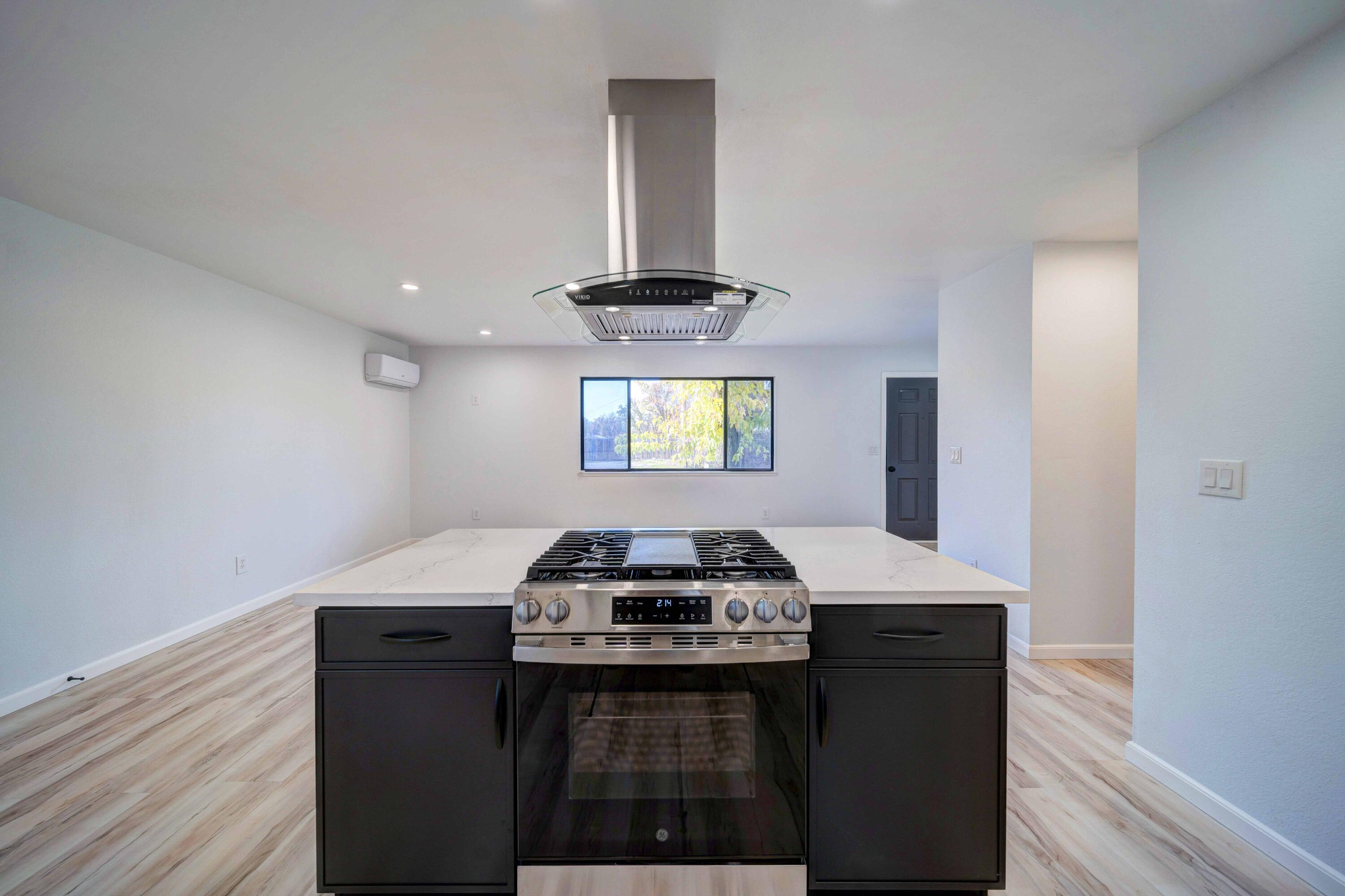 1611 2nd Street Anderson, CA 96007 - Photo 6 of 20 a kitchen with a stove and a window