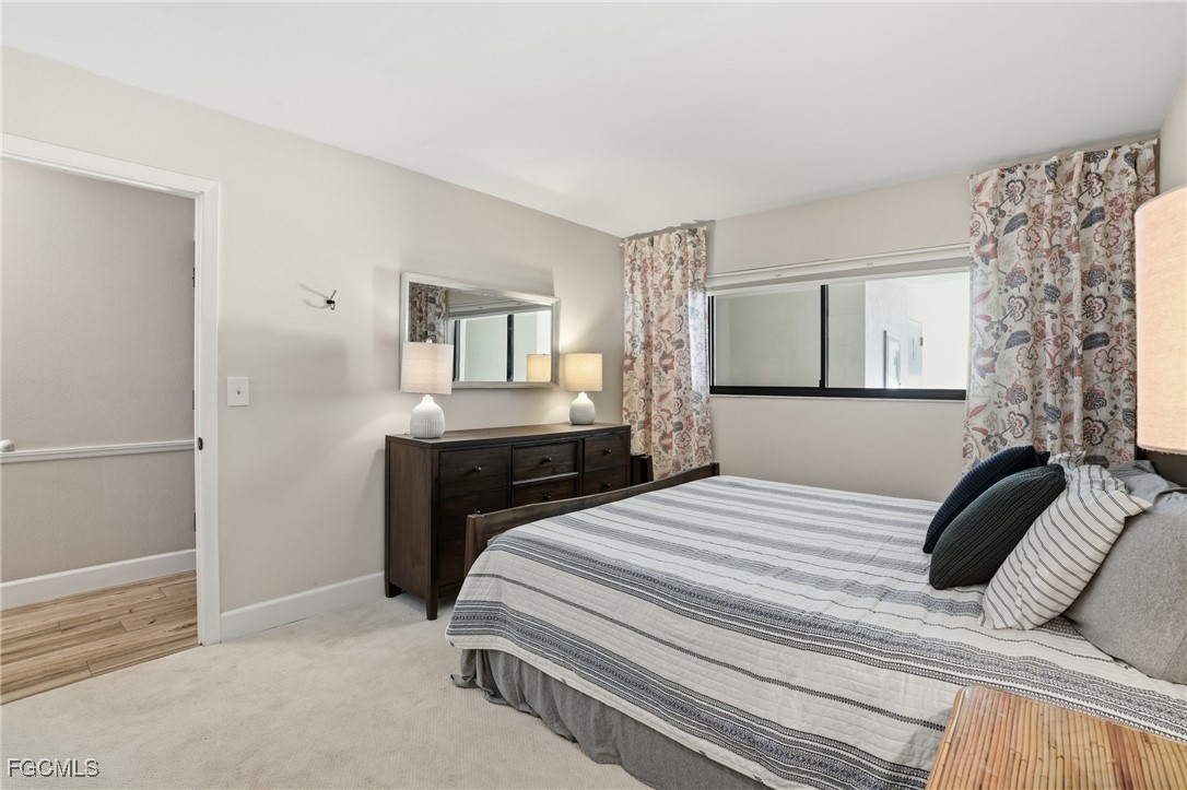 400 Lenell Road, Unit 706 Fort Myers Beach, FL 33931 - Photo 22 of 33 a bedroom with a bed and a dresser