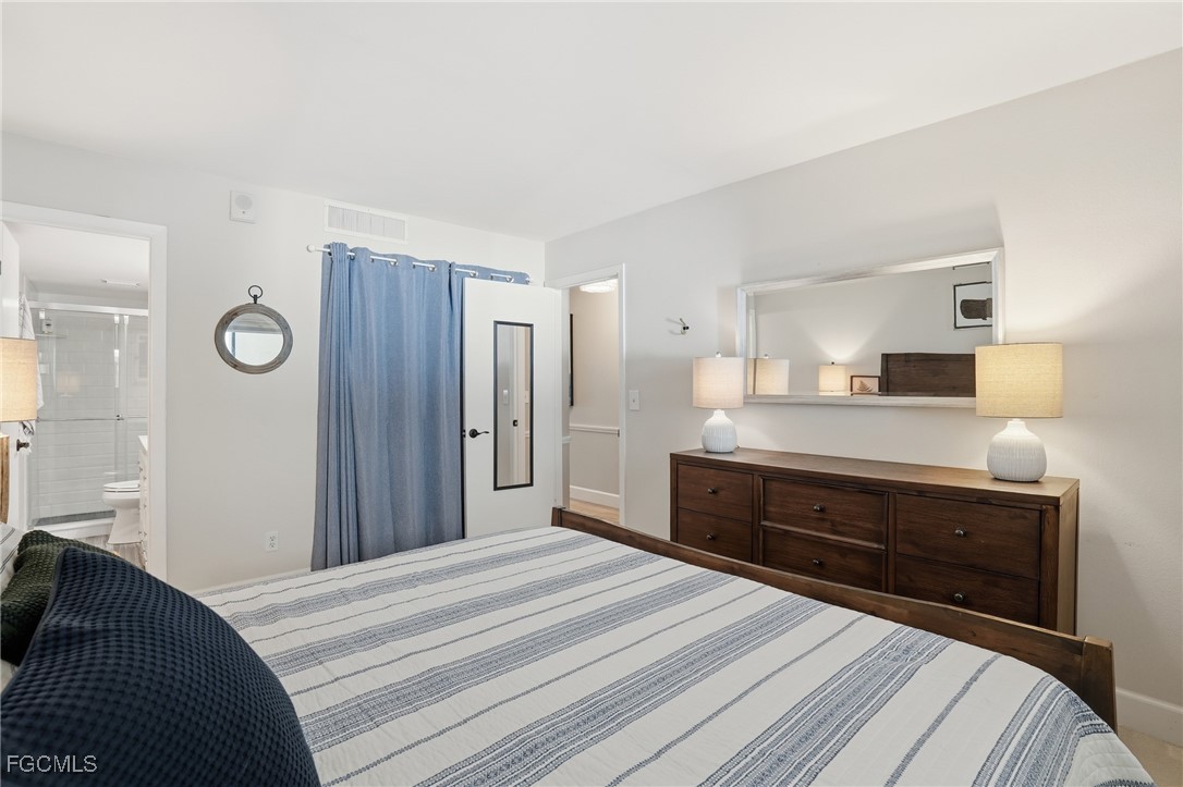 400 Lenell Road, Unit 706 Fort Myers Beach, FL 33931 - Photo 23 of 33 a bedroom with a bed and a dresser
