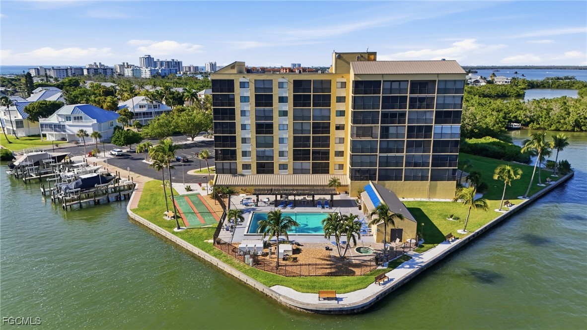 400 Lenell Road, Unit 706 Fort Myers Beach, FL 33931 - Photo 32 of 33 a view of a swimming pool with outdoor seating
