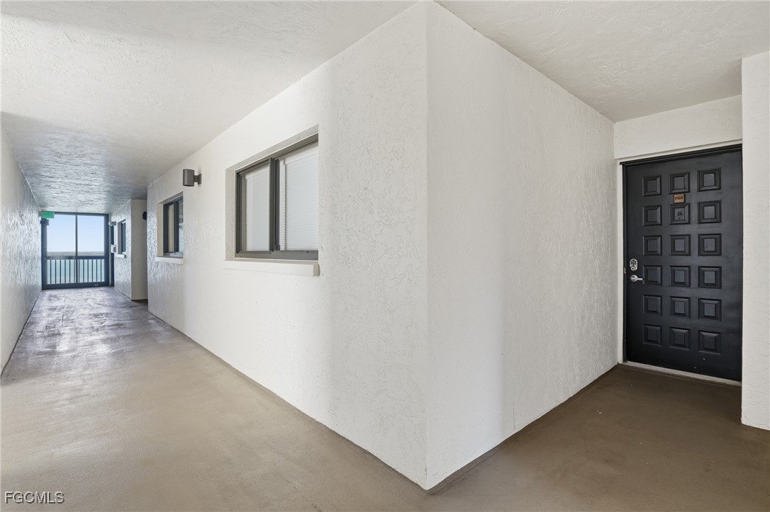 400 Lenell Road, Unit 706 Fort Myers Beach, FL 33931 - Photo 5 of 33 a view of a hallway with closet