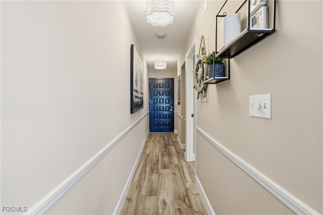 400 Lenell Road, Unit 706 Fort Myers Beach, FL 33931 - Photo 7 of 33 a view of hallway with stairs