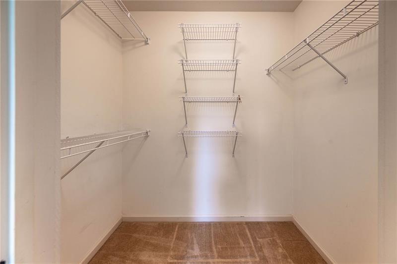 65 Orchard Drive Covington, GA 30014 - Photo 28 of 50 a view of a room with racks on the wall