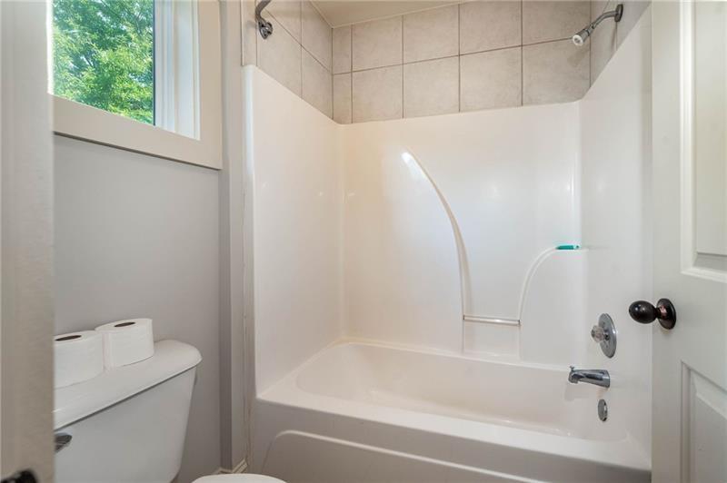 65 Orchard Drive Covington, GA 30014 - Photo 29 of 50 a bathroom with a bathtub