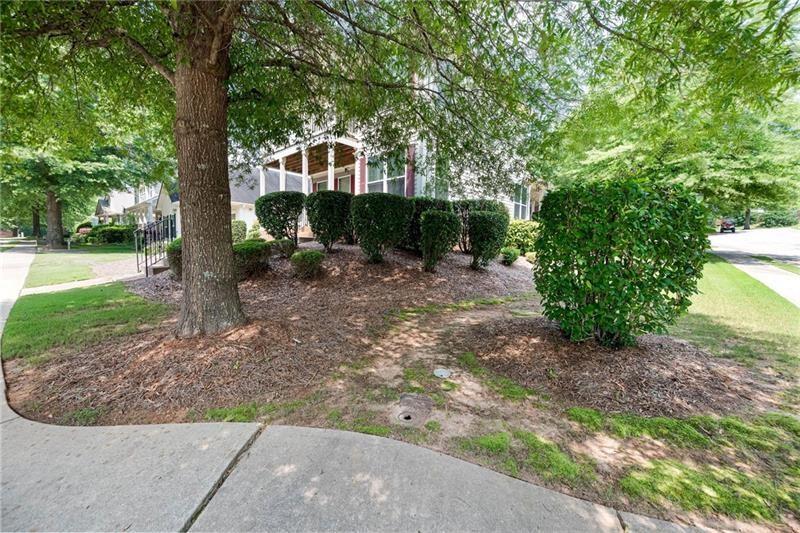 65 Orchard Drive Covington, GA 30014 - Photo 3 of 50 a front view of a house with garden