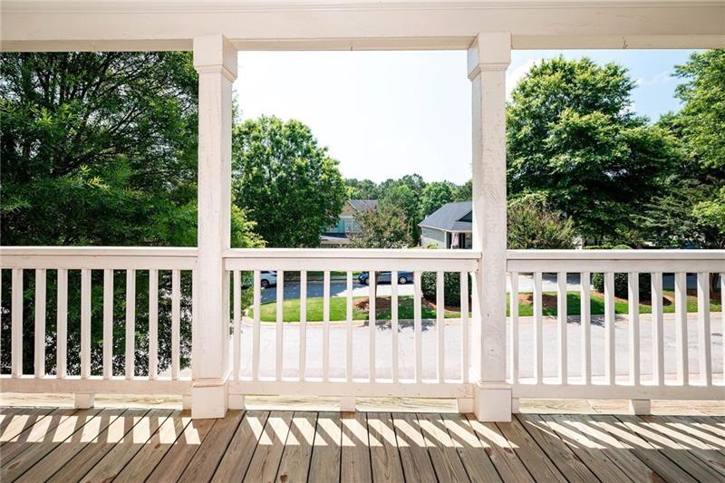 65 Orchard Drive Covington, GA 30014 - Photo 35 of 50 a view of a wooden roof deck