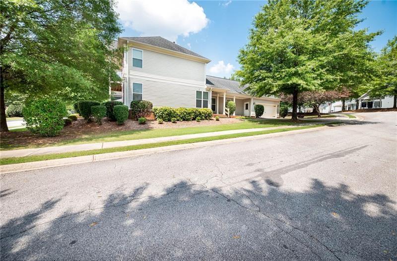 65 Orchard Drive Covington, GA 30014 - Photo 39 of 50 a view of a house with a yard and large trees