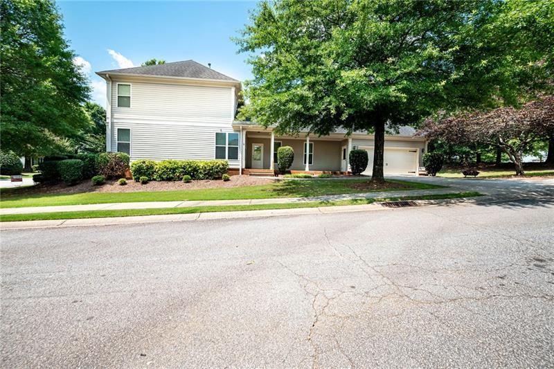 65 Orchard Drive Covington, GA 30014 - Photo 40 of 50 a front view of a house with a yard and trees