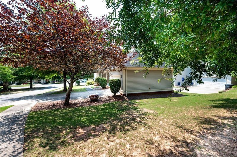 65 Orchard Drive Covington, GA 30014 - Photo 41 of 50 a backyard of a house with lots of green space