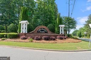 65 Orchard Drive Covington, GA 30014 - Photo 42 of 50 a front view of a house with garden