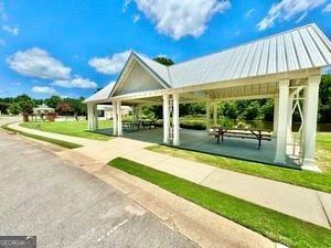 65 Orchard Drive Covington, GA 30014 - Photo 47 of 50 a view of a house with backyard and porch