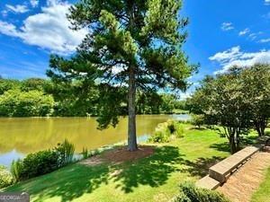 65 Orchard Drive Covington, GA 30014 - Photo 48 of 50 a view of a yard with a tree