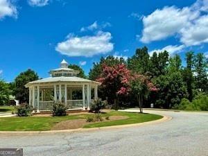 65 Orchard Drive Covington, GA 30014 - Photo 49 of 50 a view of a house with a yard and large tree