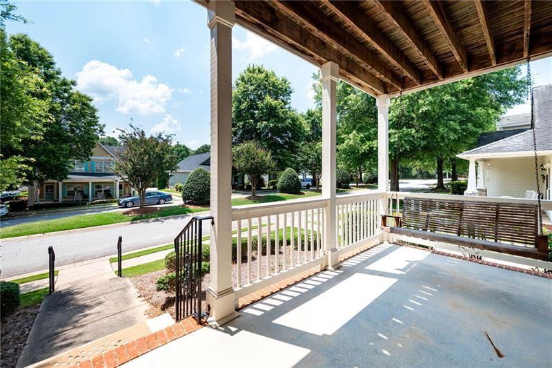 65 Orchard Drive Covington, GA 30014 - Photo 6 of 50 a view of a porch with a floor to ceiling window with wooden fence