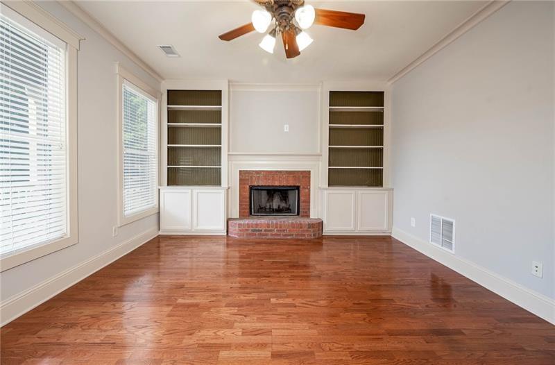 65 Orchard Drive Covington, GA 30014 - Photo 8 of 50 an empty room with windows and fireplace