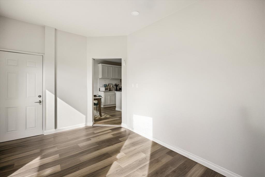 4801 West Wedgefield Road Granbury, TX 76049 - Photo 13 of 40 a view of a hallway with wooden floor and closet