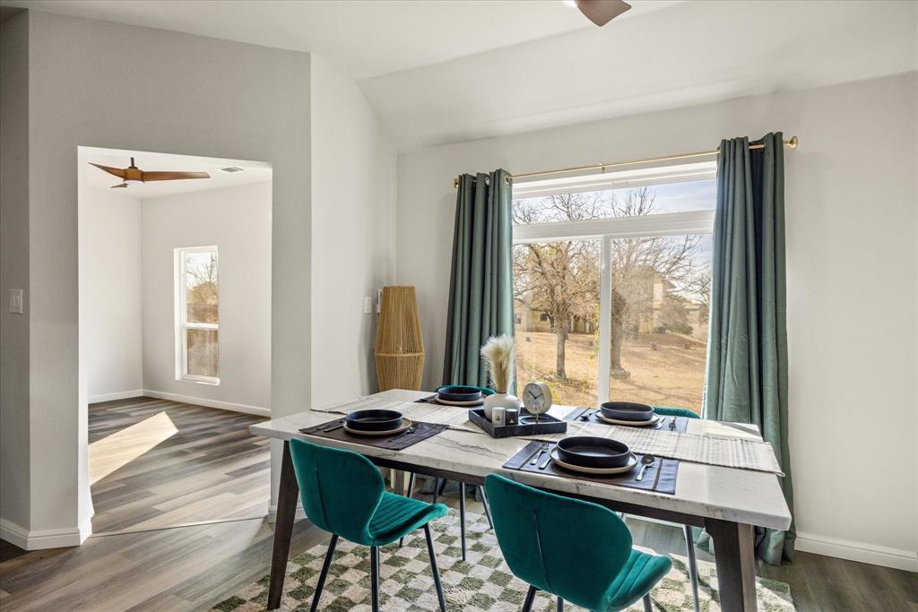 4801 West Wedgefield Road Granbury, TX 76049 - Photo 20 of 40 a view of a workspace with furniture and window