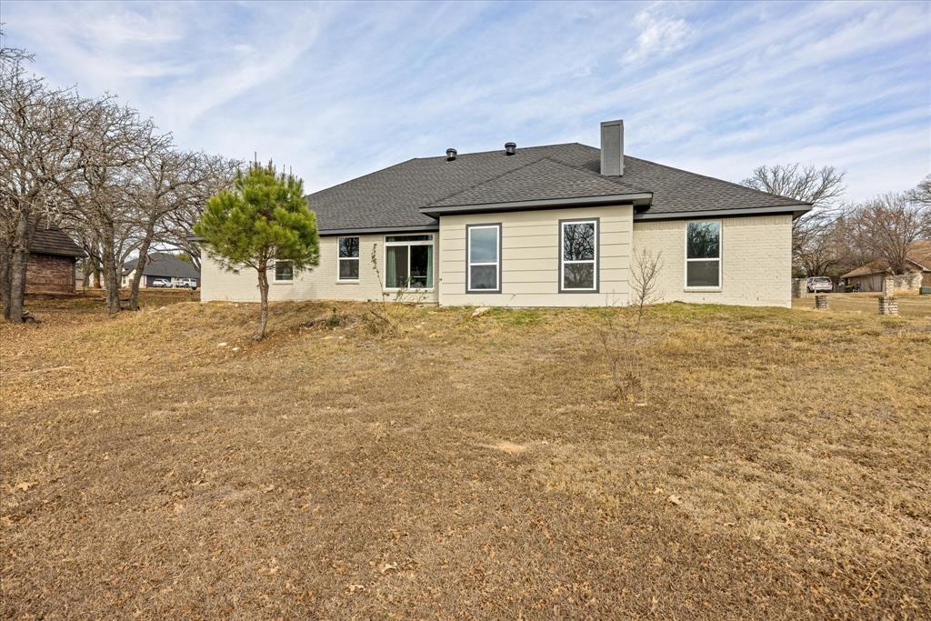 4801 West Wedgefield Road Granbury, TX 76049 - Photo 35 of 40 a front view of a house with a yard