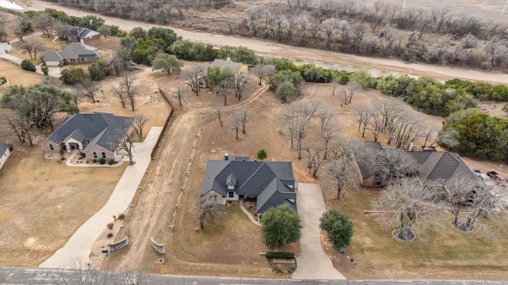 4801 West Wedgefield Road Granbury, TX 76049 - Photo 37 of 40 an aerial view of houses with outdoor space