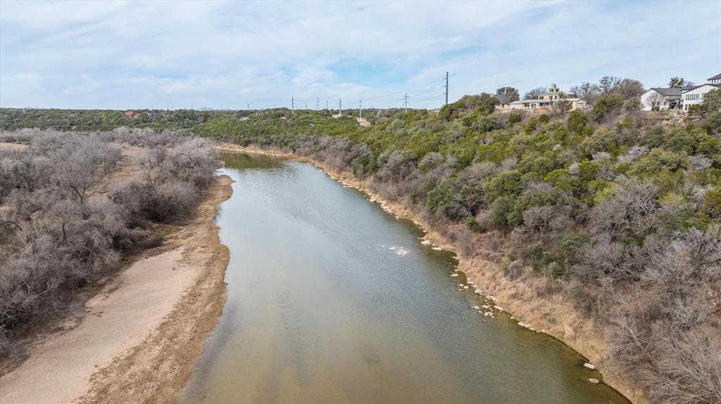 4801 West Wedgefield Road Granbury, TX 76049 - Photo 39 of 40 a view of a lake with a mountain in the back